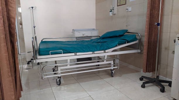 hospital medical bed with turquoise green bed sheet